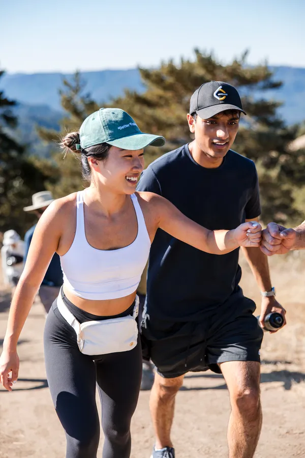Hikers laughing on a group trail event