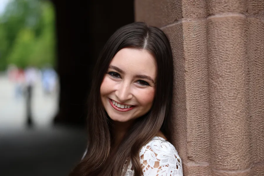 Smiling portrait against warm sandstone