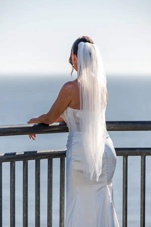 Bride looking out over the ocean